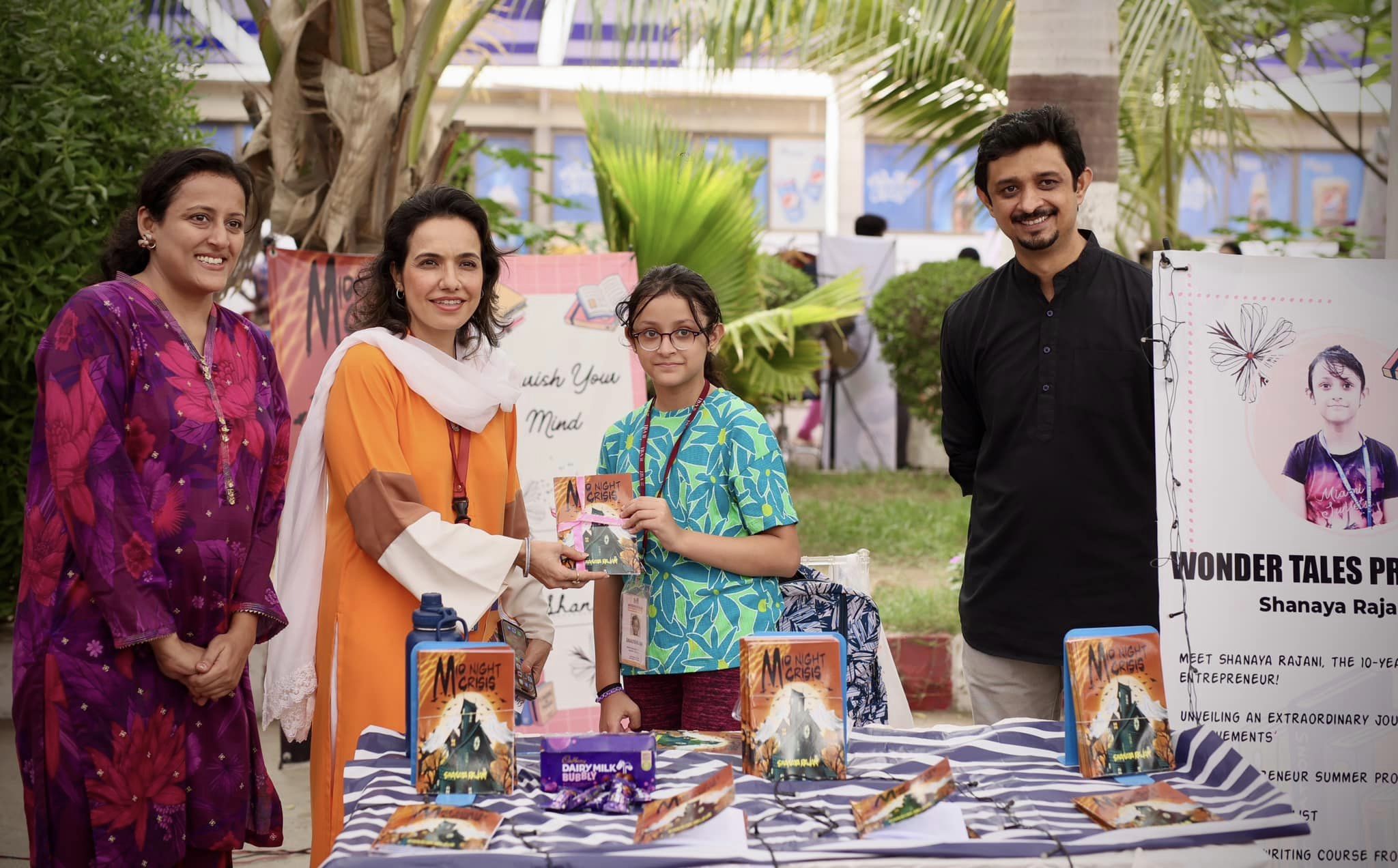 Young author meeting visitors during an I-Bazaar book presentation